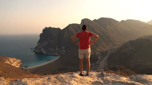Young Man Admire Amazing Bay View in Mountains Admire
