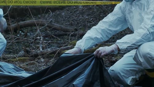 Forensic Specialist Working in the Forest Police Criminalists Collecting Evidence and Making