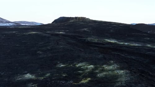 Black Basalt rock solidified lava flow below Geldingadalsgos volcano, aerial