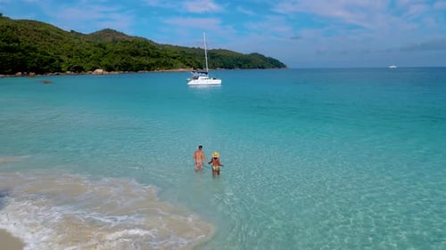 Couple in the Blue Ocean on the Beach of Anse Lazio Beach Praslin Island Seychelles