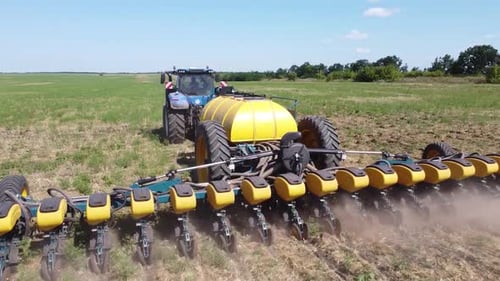 Blue Tractor O.A. Planting Canola On No Till Field