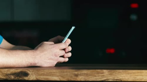 Close Up of Hands Using a Smartphone Device