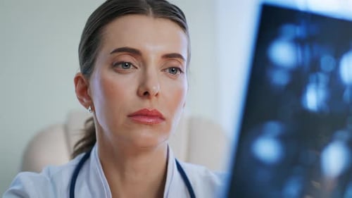 Healthcare Provider Reading Xray Scan at Medical Examination Clinic Closeup