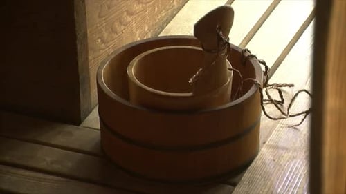 Wooden Bucket and Ladle in a Sauna