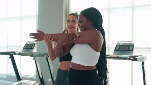Women Stretching in Gym