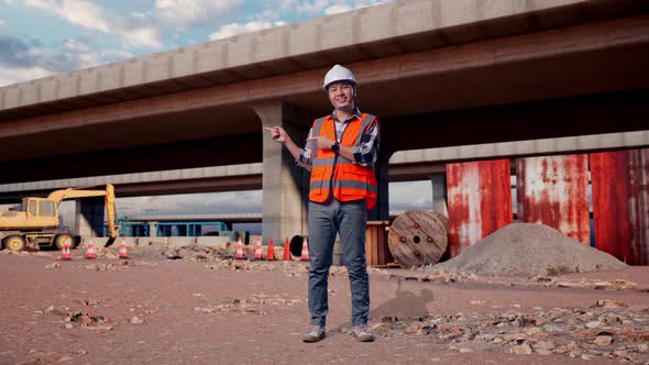 Full Body Of Asian Male Engineer Smiling And Pointing To Side At ...