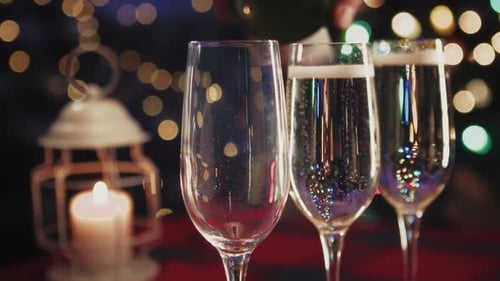 Sparkling Wine Pour at Christmas Holiday Celebration