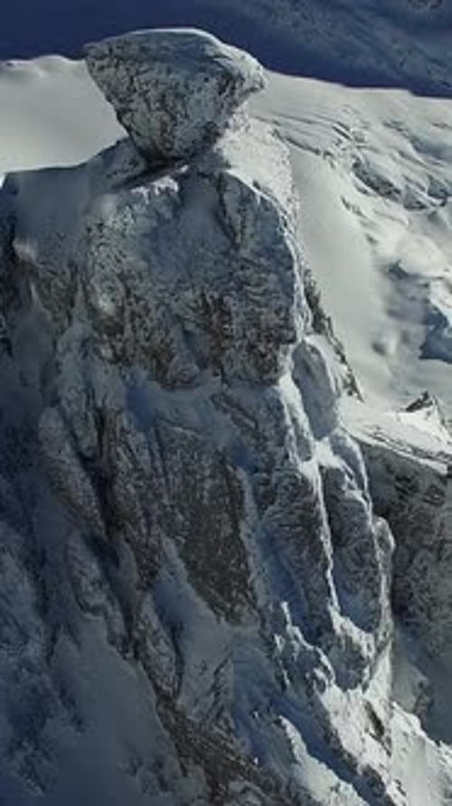 The Majestic and Beautiful SnowCapped Mountain Peak Surrounded By Alpine Heights