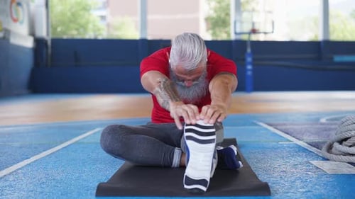 Senior Hipster Athlete Doing Stretching Before Training - Tattoo Fitness Man Doing