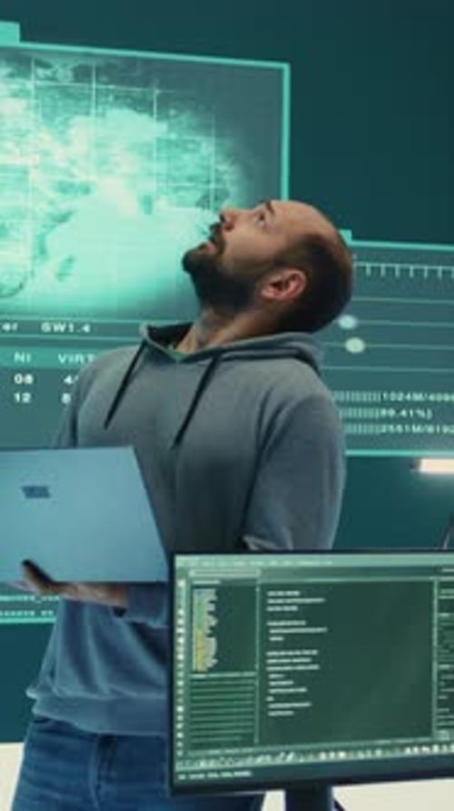 Vertical Video Cyber Defense Expert Examining Data on a Big Screen in Governmental Agency