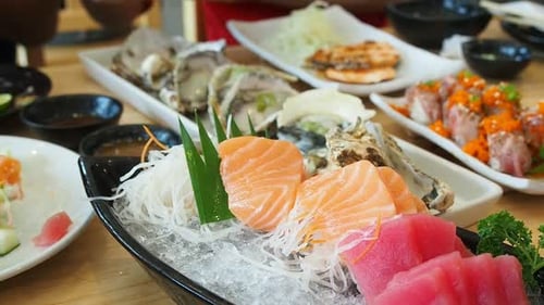 Assortment of colorful Japanese Cuisine on Wooden Table