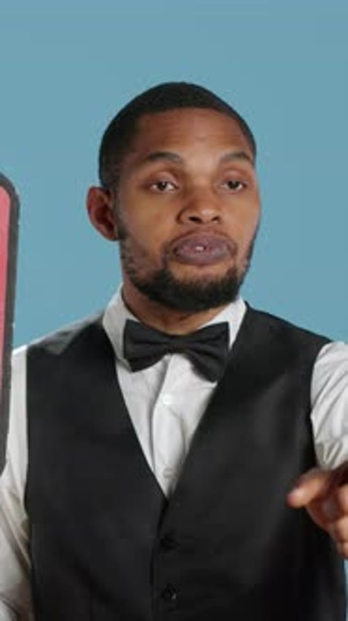 Vertical Video Political Bellboy Hotelier Showing a Speech Bubble with the Message to Vote