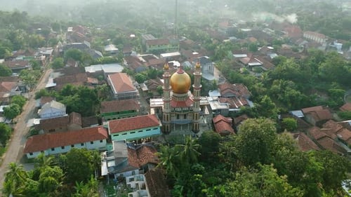 Drone view Zooming out from top of Bermi Golden Mosque, Bermi Central Java Indonesia