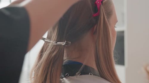 Woman Getting Hair Cut and Styled in Salon
