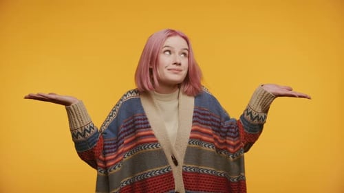 Woman with Pink Hair Gestures Indecision