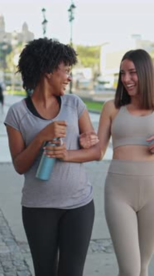 Smiling Women Walking Together After Fitness Training