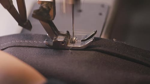 Close Up of Sewing Machine Stitching Dark Fabric