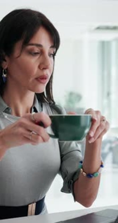 Woman, coffee and thinking with laptop in office on break, perspective or smile at finance company