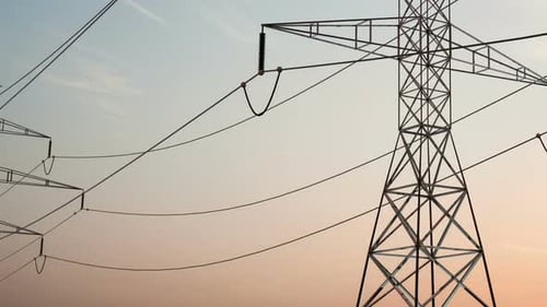 High Voltage Electricity Tower and Power Lines Under the Beautiful Sky