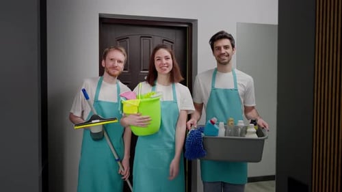 Happy Cleaning Crew Holding Supplies