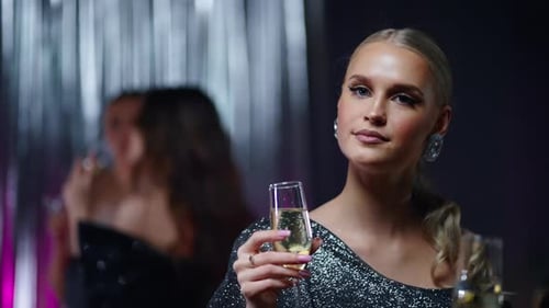 Blonde And Brunette Women Resting In Merry Party In Gala Event Drinking Champagne And Chatting