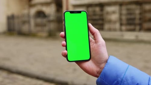 NEW YORK December 19 2020 Shot Hands Man Using Phone with Vertical Green Screen Background Street