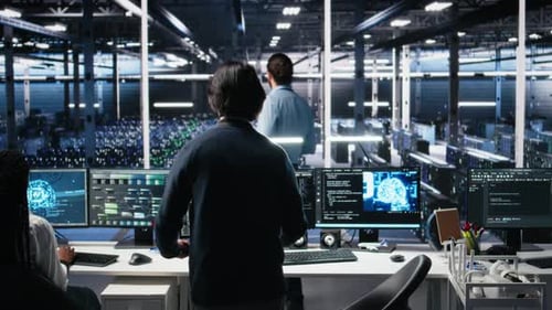 Programmer Entering Server Room Office Using AI to Review Infrastructure Diagnostics