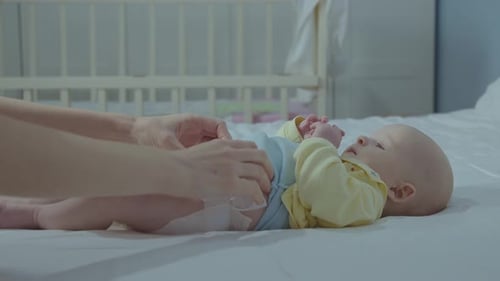 Adorable Baby Getting Diaper Changed at Home