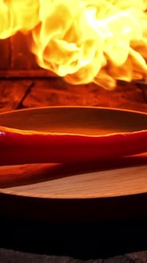 Red Hot Chili Pepper on Black Background with Flame Spicy Food Concept Stock Footage Close Up of a