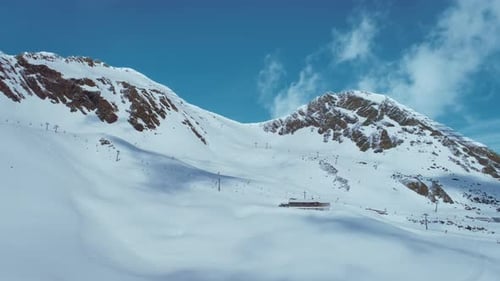 Sunny Day Over Ski Resort Lifts and Slopes