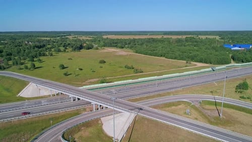 Transport Interchange on the Highway Aerial of Cars Drive Along the Highway Outside the City