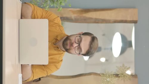 Man at Computer Gives Thumbs Up