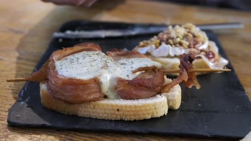 Pinchos close up. Counter in a tapas and pinchos bar in la rioja, spain. Croqueas, peppers, meat and