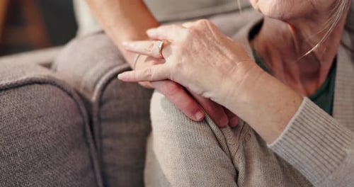 Tender Moment Between Two Family Members on Couch