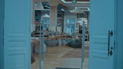 Rows of Different Colorful Books Lying on the Shelves in the Modern Urban Bookshop