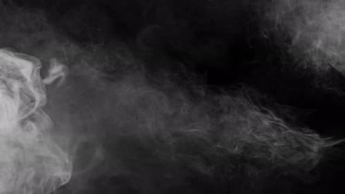 Realistic White Smoke Flowing on Black Background