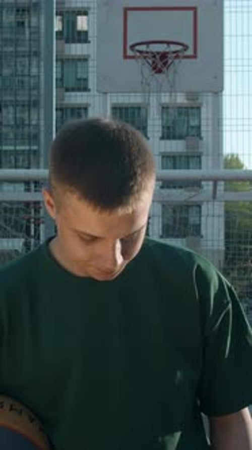 A Handsome Male Athlete Media A Man Standing on a Volleyball Court with a Ball