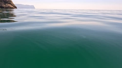 Sea Water Surface Low Angle View Over Clear Azure Sea Water Sun Glare Abstract Nautical Summer Ocean