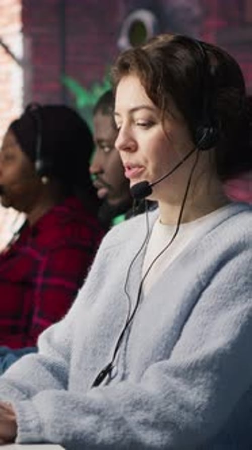 Vertical Video Call Center Team of Agents Wearing Headset Assisting Customers
