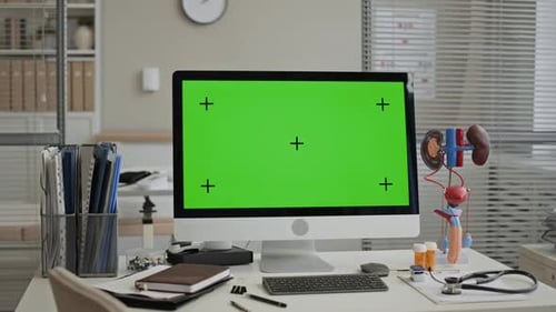 Desktop Computer with Green Screen in Medical Office Mockup