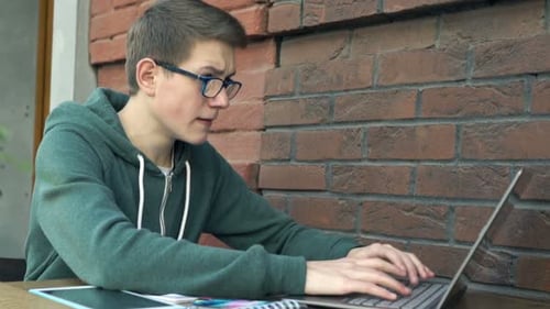 Teen Student Working on Laptop Computer, Tablet, Phone
