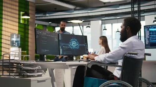 Computer Scientist with Paraplegia in Office Automating Repetitive Tasks with AI