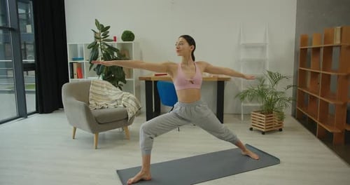 Athletic Woman Doing Yoga Exercise at Home