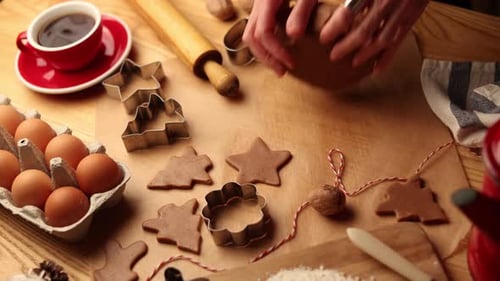 Making Christmas Cookies at Home on Wooden Table