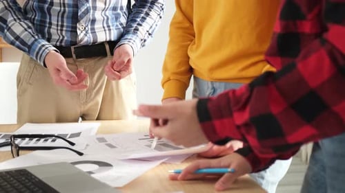 Business Meeting Discussing Charts and Graphs