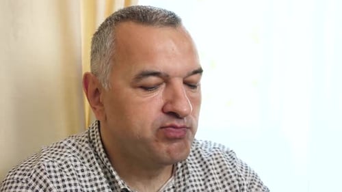 Man Eating Popcorn in Close Up, Indoors