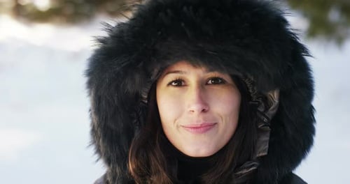 portrait A girl walks through the woods, breathe pure air, smiles in the nature of the mountain
