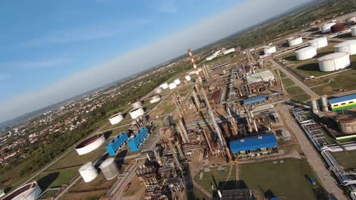 Aerial Top Down View Over Oil Refinery or Chemical Factory and Power Plant with Many Storage Tanks