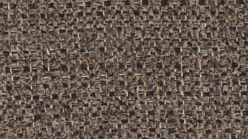 Slow zoom in on thickly woven brown upholstery with sturdy threads