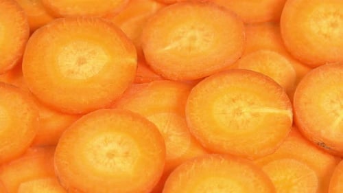 Bright Orange Carrot Slices Piled Close Up